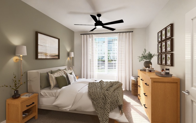 a bedroom with a bed and a fan