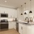 a kitchen with white cabinets